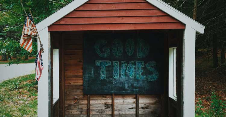 cabin with a sign that says good times