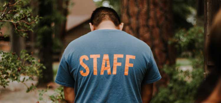 camp counselor in a staff T-shirt