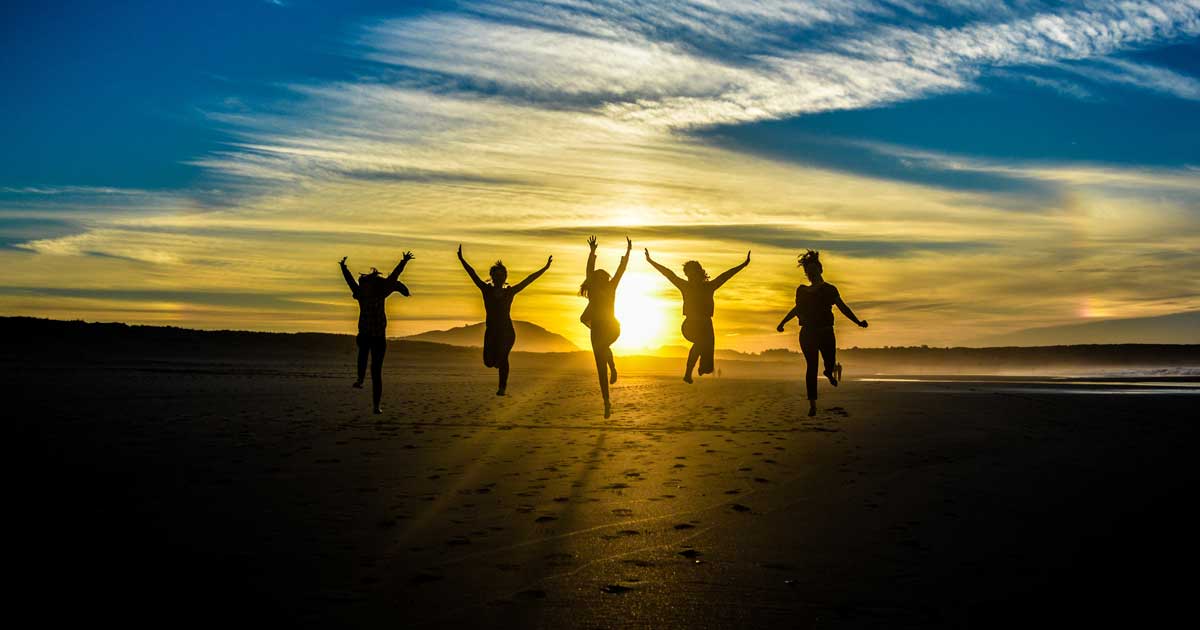 group of people leaping in the air