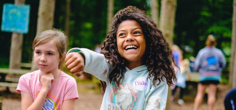as an example of summer camp photography two girls smiling