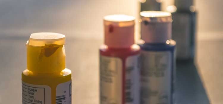 paint bottles at summer camp for kids with neuromuscular disorders