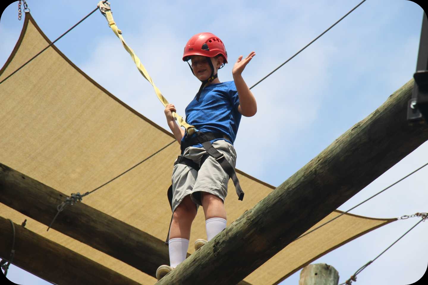 A camper at YMCA Camp High Harbour on the ropes course