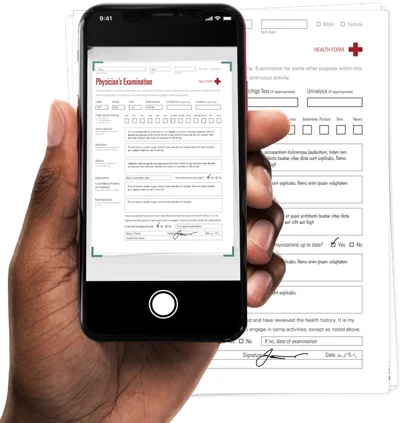 A hand holding a phone and using it as a mobile scanner for a health form
