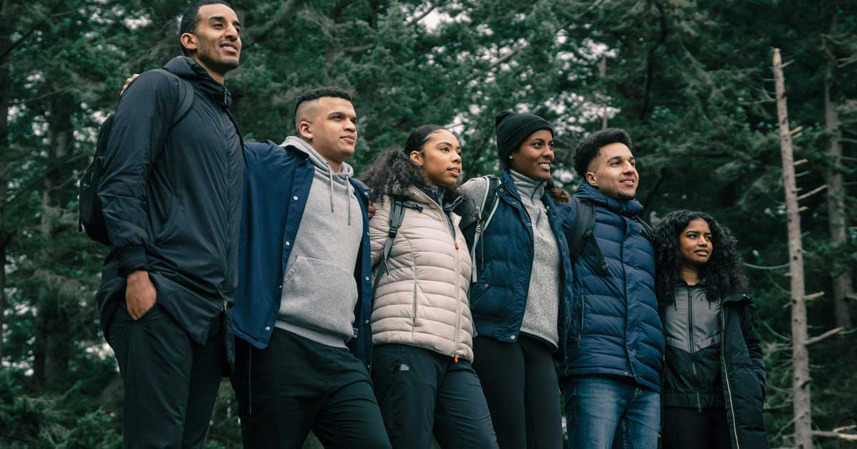 A group of summer camp alumni standing outside